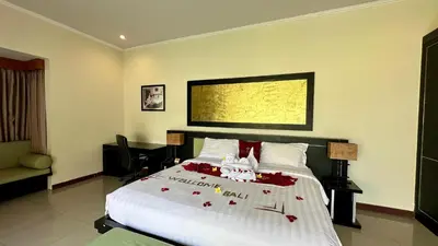 a bedroom with a bed with red flowers on it at 1 Bed Room Private Pool Villa in Seminyak - PBM1 in Seminyak