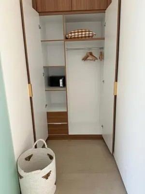 a walk in closet with a white door and a basket at Villa Alkasa - Legian 400m to beach in Badung