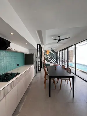 a kitchen and dining room with a table and chairs at Villa Tara in Seminyak