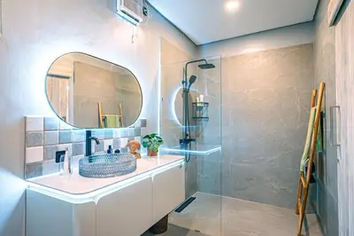 a bathroom with a sink and a mirror at Amshiga 1 in Jimbaran