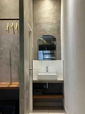 a bathroom with a sink and a mirror at Odua Mezzanine - Bromo in Denpasar
