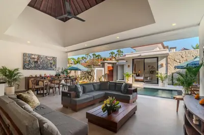 an open living room with a couch and a table at Villa Vela 1 - Brand new 3 bedroom villa in Seminyak