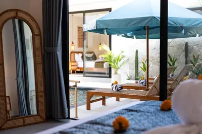 a room with a swing with an umbrella at Villa Vela 1 - Brand new 3 bedroom villa in Seminyak
