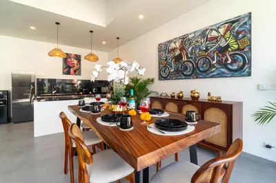 a dining room with a wooden table and chairs at Villa Vela 1 - Brand new 3 bedroom villa in Seminyak