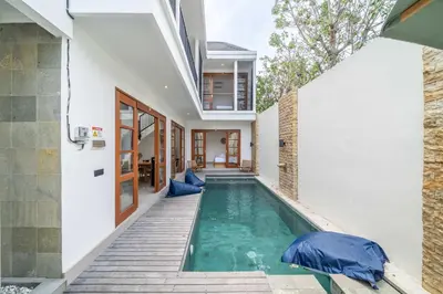 a swimming pool in the backyard of a house at 3BR Pool Villa in Berawa - Walk to Beach & Cafes in Canggu