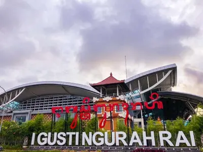 a building with a sign in front of it at RBE Hotel Kuta 3- 5 Min to Airport&Beach by Micky Studio in Ngurah Rai International Airport