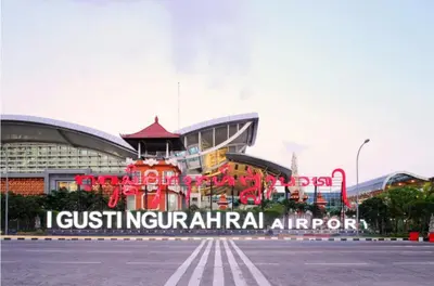 a building with a sign in front of a stadium at RBE Hotel Kuta 4- 5 Min to Airport&Beach by Micky Studio in Ngurah Rai International Airport