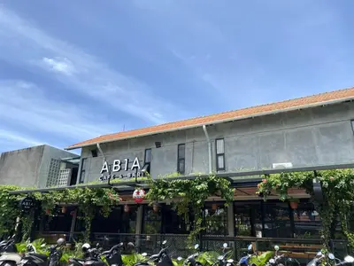 a building with motorcycles parked in front of it at Abia Villa Legian in Legian