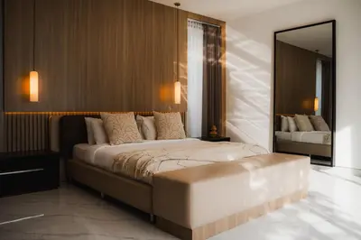 a bedroom with a large bed and a mirror at Villa Toku by BaliSuperHost in Seminyak