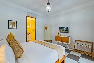 a bedroom with a bed and a dresser in it at Private 2 Br Pool Villa, 400m to Beach, Sleeps 4 in Seminyak