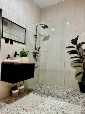a bathroom with a sink and a shower at Villa Vela 6 BR Seminyak in Seminyak