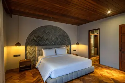 a bedroom with a large white bed in a room at Sonaa Villa Bali in Canggu