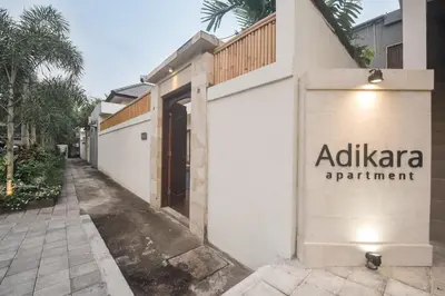 a building with a sign that reads alpha apartment at Adikara Villa 2 Cozy 2BR in Canggu, Berawa 5 mins to the beach in Canggu