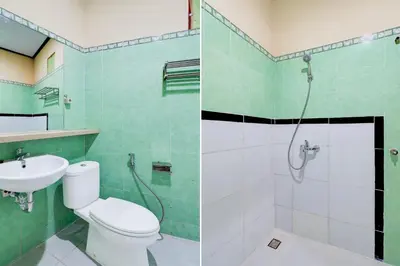 a bathroom with a toilet and a shower and a sink at Townhouse Oak @lebak Bene Near Kuta Beach in Balian