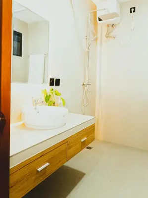 a bathroom with a sink and a mirror at Brand New! Villa Putu Seminyak in Kerobokan