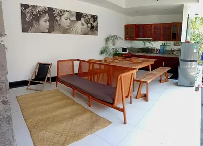 a kitchen with a table and a dining room at Villa Diraya 2 Bedroom Villa in Kerobokan in Kerobokan