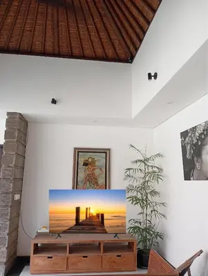 a living room with a painting on the wall at Villa Diraya 2 Bedroom Villa in Kerobokan in Kerobokan