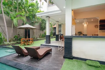 a house with a swimming pool and a patio at New Villa 50 Seminyak in Seminyak