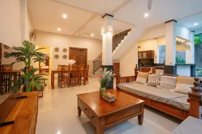 a living room with a couch and a table at New Villa 50 Seminyak in Seminyak