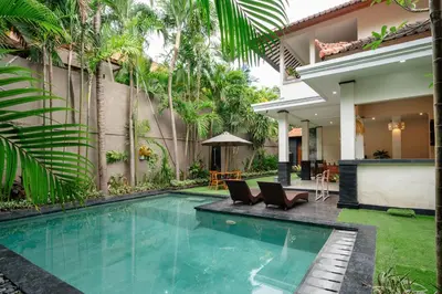 a swimming pool in the backyard of a house at New Villa 50 Seminyak in Seminyak