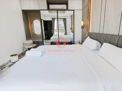 a bedroom with a bed with a sign that reads second home rental like home at Luxury 3BR Krobokan Villa B Pool&Wi-Fi in Kerobokan