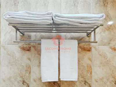 a rack with towels and a sign in a bathroom at Luxury 3BR Krobokan Villa B Pool&Wi-Fi in Kerobokan