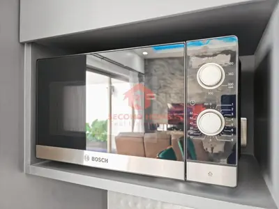 a microwave oven on a shelf in a room at Luxury 3BR Krobokan Villa B Pool&Wi-Fi in Kerobokan