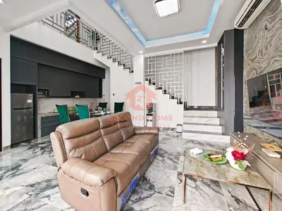 a living room with a couch and a table at Luxury 3BR Krobokan Villa B Pool&Wi-Fi in Kerobokan