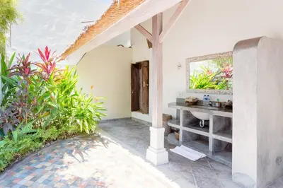 a bathroom in a house with a sink and plants at Five Star Reviews, Airbnb Plus, Awesome Location in Seminyak