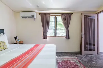 a bedroom with a bed and a window at Five Star Reviews, Airbnb Plus, Awesome Location in Seminyak