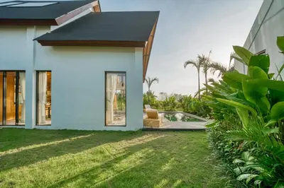 a house with a view of a yard at New! Architectural 2BR Villa near Seminyak in Kerobokan