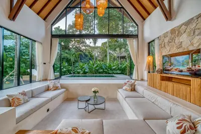 a living room with a large window and a tub at New! Designer Arch Villa with pool near Seminyak in Kerobokan