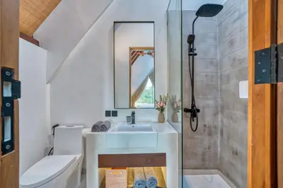 a bathroom with a sink and a shower at New! Designer Arch Villa with pool near Seminyak in Kerobokan