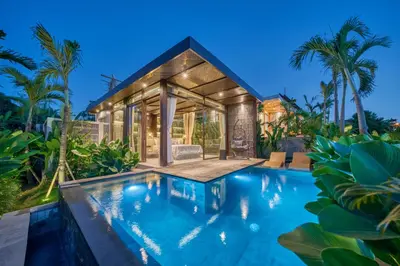 a house with a swimming pool in front of it at New Sleek 1BR Retreat with Pool Near Seminyak in Kerobokan