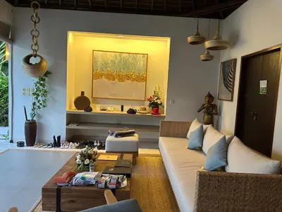 a living room with a couch and a table at Saba Villas in Canggu