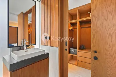 a bathroom with a sink and a mirror at Andra Villa by Kozystay - Natadesa Resort Jimbaran in Jimbaran