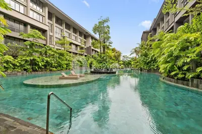 a swimming pool in the middle of a building at Caraya by Kozystay - Nusa Dua in Nusa Dua