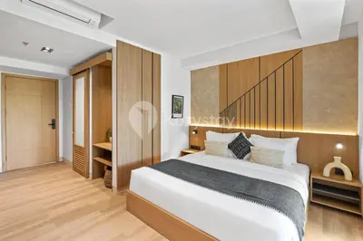 a bedroom with a large bed in a room at Levora by Kozystay - Nusa Dua in Nusa Dua