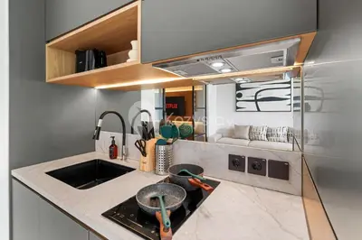 a kitchen with a sink and a counter top at Levora by Kozystay - Nusa Dua in Nusa Dua