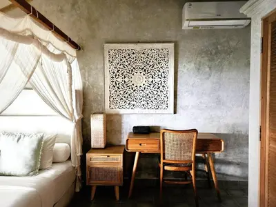 a bedroom with a desk and a bed and a table at Villa Hibou - New Tropical Luxury 2BR near Canggu in Canggu