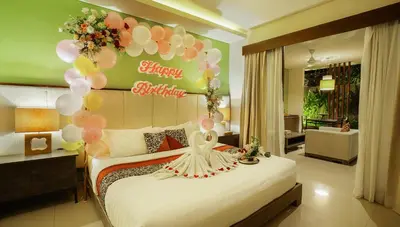 a bedroom with a bed with a bunch of balloons at Royal Samaja Villas in Seminyak