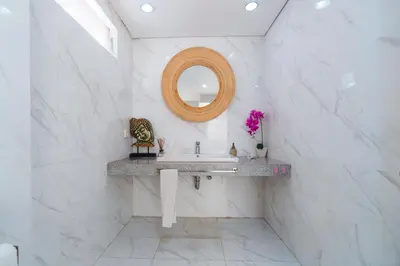 a white bathroom with a sink and a mirror at Villa C31 Seminyak in Seminyak