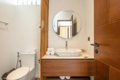 a bathroom with a sink and a mirror at Serene 5-Bedroom Villa 400 m from Batu Bolong in Canggu