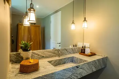 a bathroom with a sink and a large mirror at Anam Khaya - Brand New Villa, Walk to Seminyak Beach in Seminyak