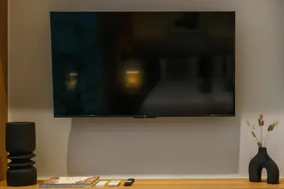 a flat screen tv hanging on a wall at Contemporary 2BR Luxury Villa with Rooftop View and Pool in Kerobokan