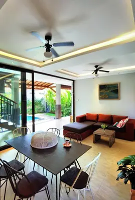 a living room with a table and a couch at Bob's Hideaway Villa - Umalas in Umalas