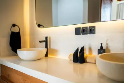 a bathroom with two sinks and a mirror at New Luxury 3BR Villa walk to Atlas, Finns & Berawa beach in Canggu