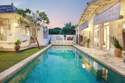 a swimming pool in the backyard of a house at Villa Bohème Umalas in Canggu