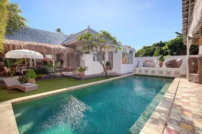 a swimming pool in the backyard of a house at Villa Bohème Umalas in Canggu