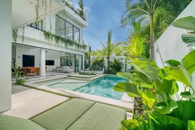 a swimming pool in the backyard of a house at Rooftop Villa Elegant 4BR Retreat in Umalas in Kerobokan